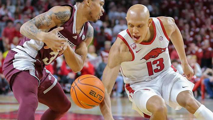 Arkansas forward Jordan Walsh scraps for the ball against Mississippi State.